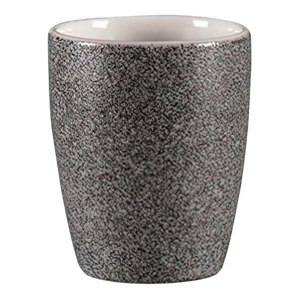 A white porcelain RAK coffee cup with black accents and dual handles.