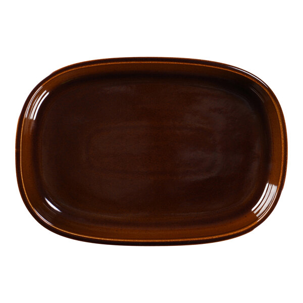 A brown oval RAK Porcelain plate with a white background.