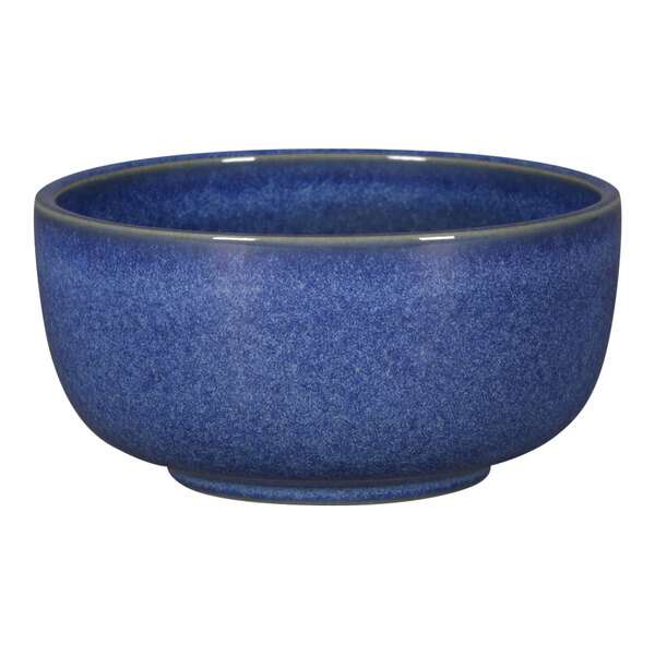 A blue RAK Porcelain bowl with a speckled rim.