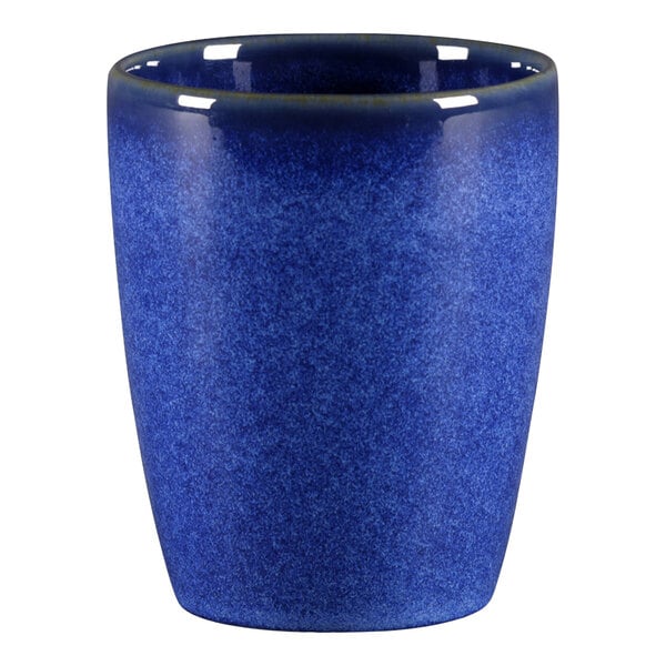 A RAK Porcelain cobalt blue ceramic coffee cup with no handle.