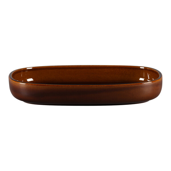 A brown oval porcelain dish with a white background.