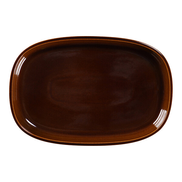 A brown oval porcelain plate with a white background and rim.