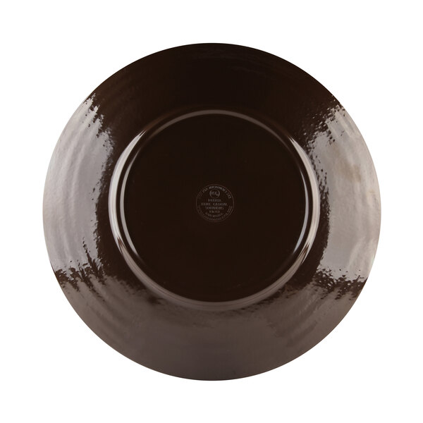 An aubergine-colored Elite Global Solutions round melamine plate with a circular design.