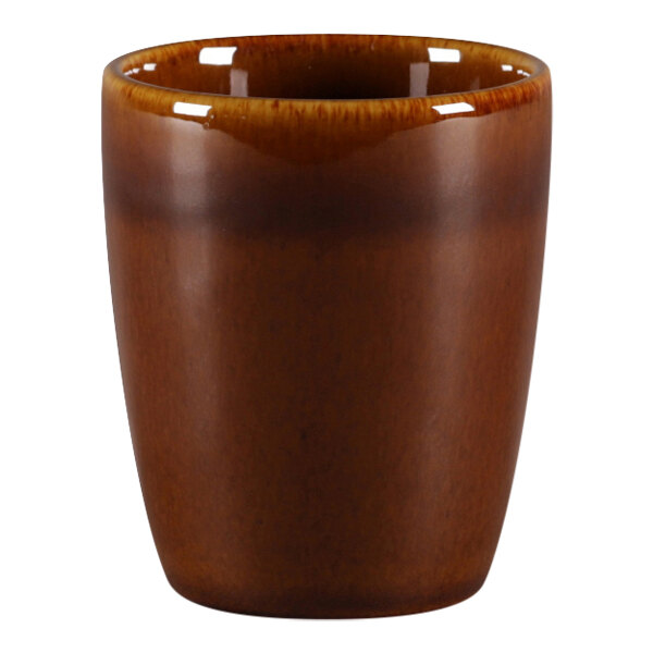 A brown porcelain RAK espresso cup with a brown rim.