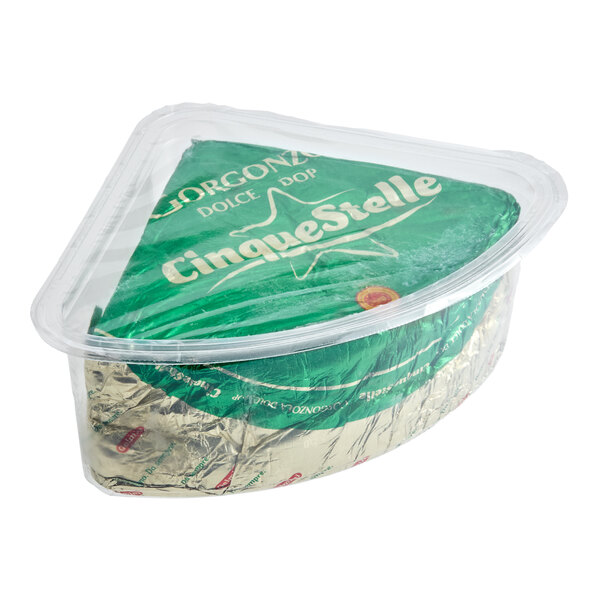 A wedge of Gelmini Cinque Stelle DOP Dolce creamy Gorgonzola cheese in a green and gold foil wrapper, packaged in a clear plastic container.