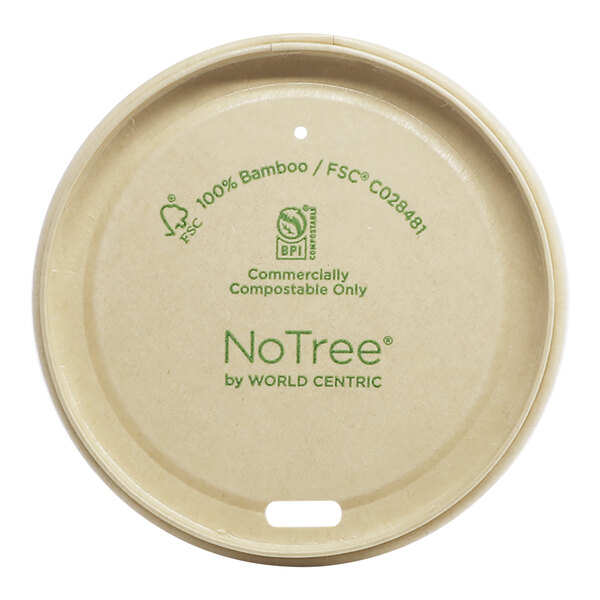 A round white World Centric compostable lid with green text on it.