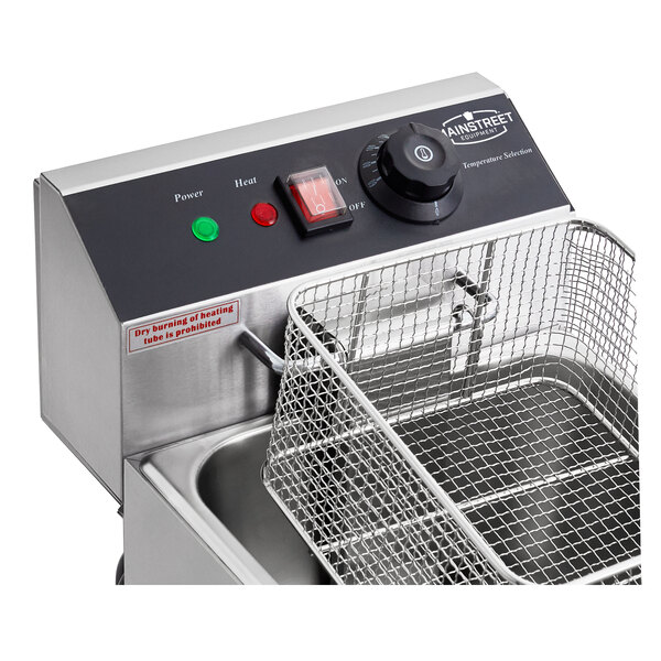 A MainStreet Equipment electric countertop fryer with a basket on a counter.