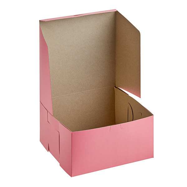 A pink Southern Champion cake box with the lid open.