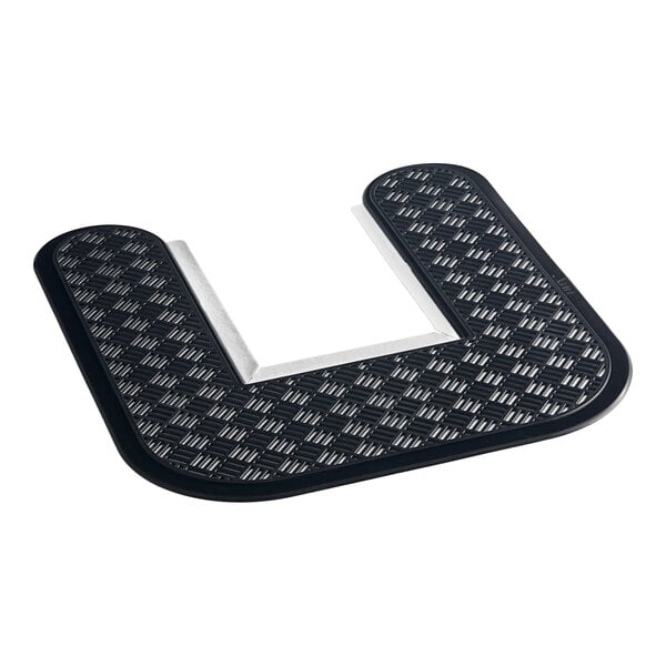 A black mat with a white pattern of toilet symbols.