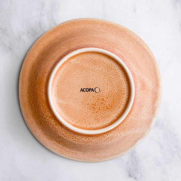 An Acopa Highlands primrose pink bowl on a white plate.