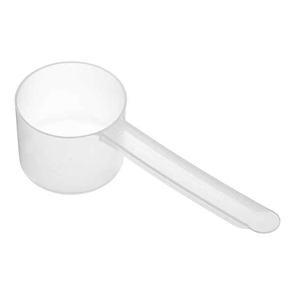 A clear plastic measuring scoop with a long handle.