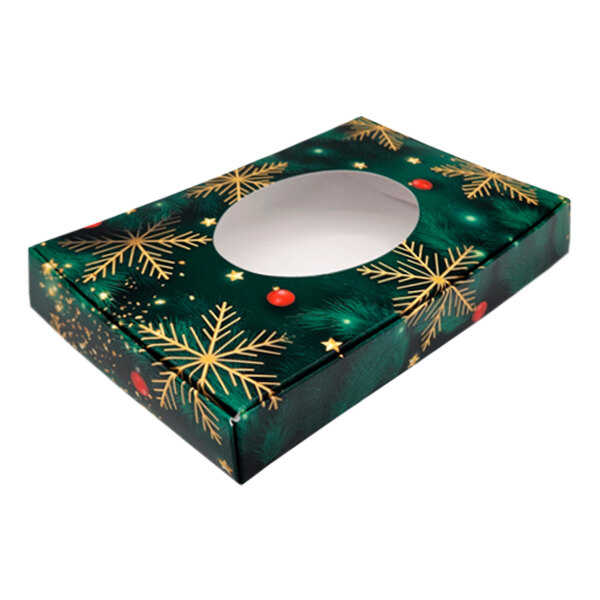 A green candy box with an oval window and a snowflake design.