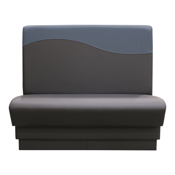 A grey and black booth with a black wave design on the back.