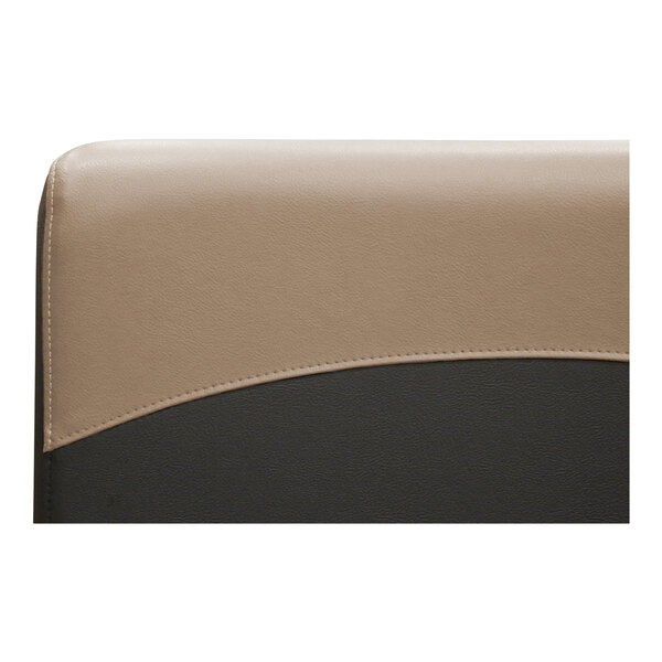 A beige leather booth with a wave design on the back.
