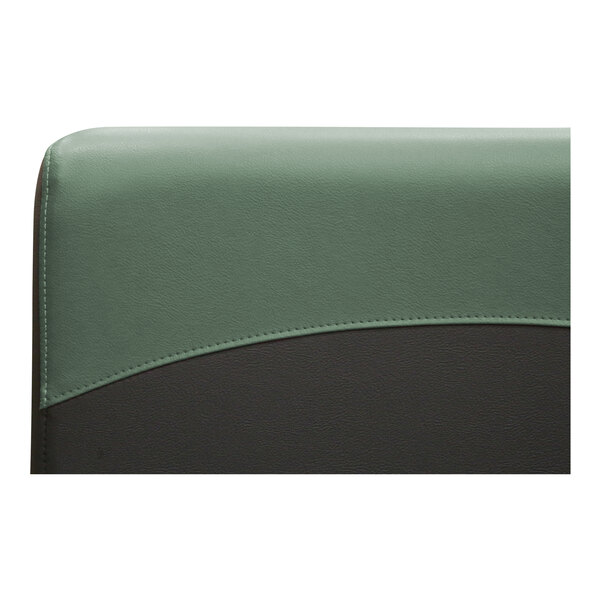 A QA Group green and black leather booth with green and black trim.