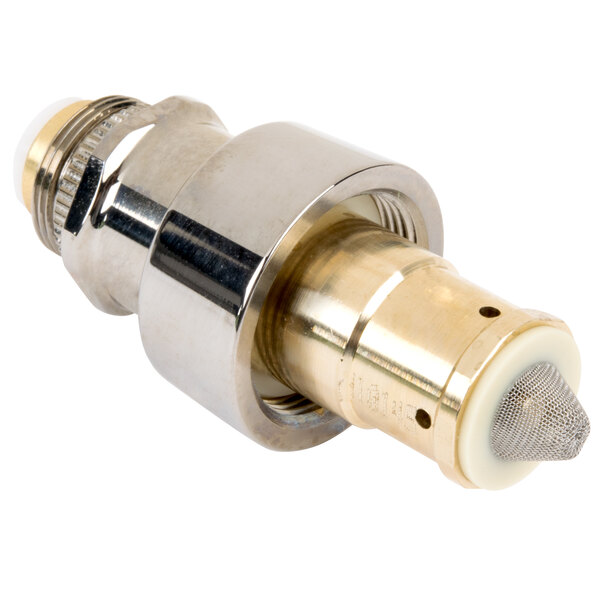 A close-up of a T&S brass and gold metal metering cartridge with retaining nut.