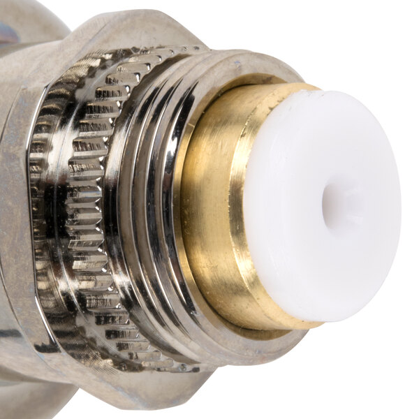 A close up of a metal and white T&S metering cartridge with a white wheel.