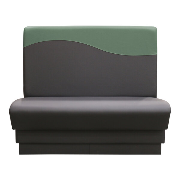 A QA Group Evergreen Wave single back booth with green and black upholstery.