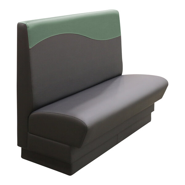 A grey and green booth with a green seat and wave pattern on the back.