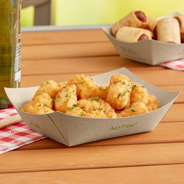 A World Centric compostable paper food tray filled with fried food.