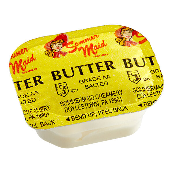 A close up of a Sommer Maid whipped butter portion cup with a label.