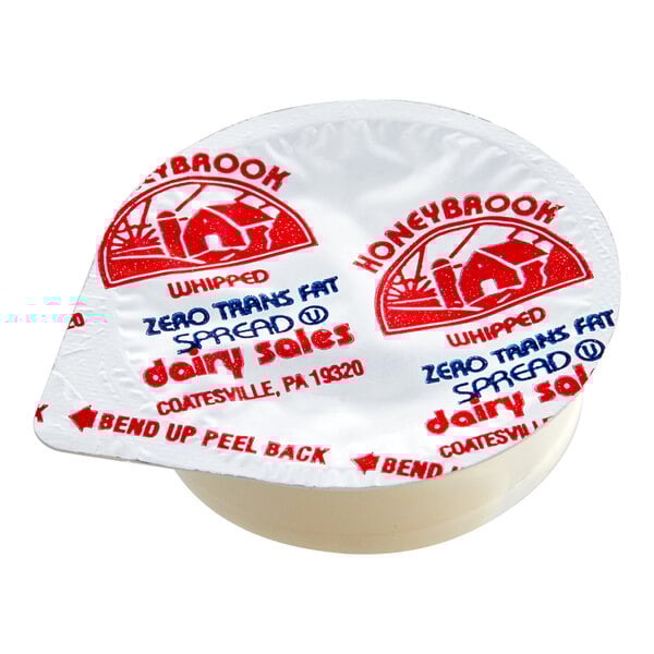 A package of Honeybrook Whipped Margarine portion cups with red and blue labels.