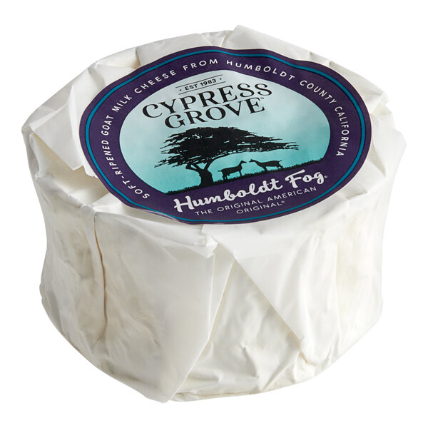 A round white roll of Cypress Grove Humboldt Fog cheese wrapped in paper.