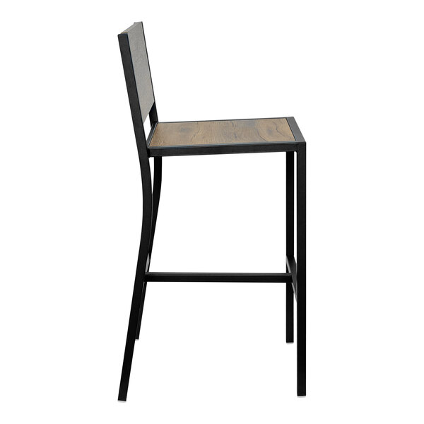 A BFM Seating black powder-coated steel barstool with a knotty pine wood seat and back.