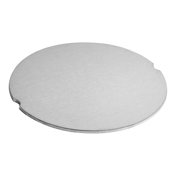 A circular silver metal screw cover.