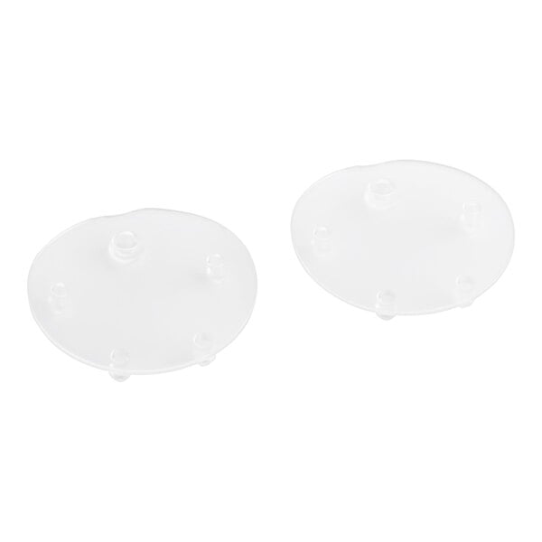 A pair of clear round silicone discs with holes.