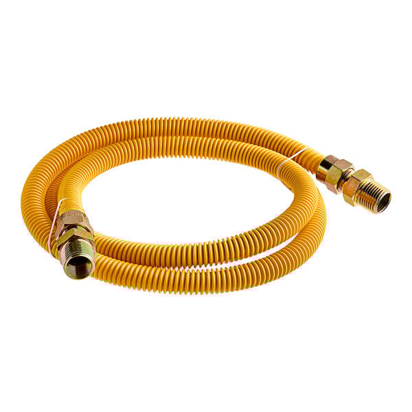 A close-up of a yellow Eastman gas connector hose with brass nozzles.