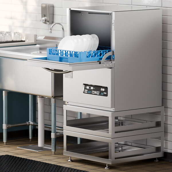 A Noble Warewashing undercounter dishwasher on a metal stand with plates in it.