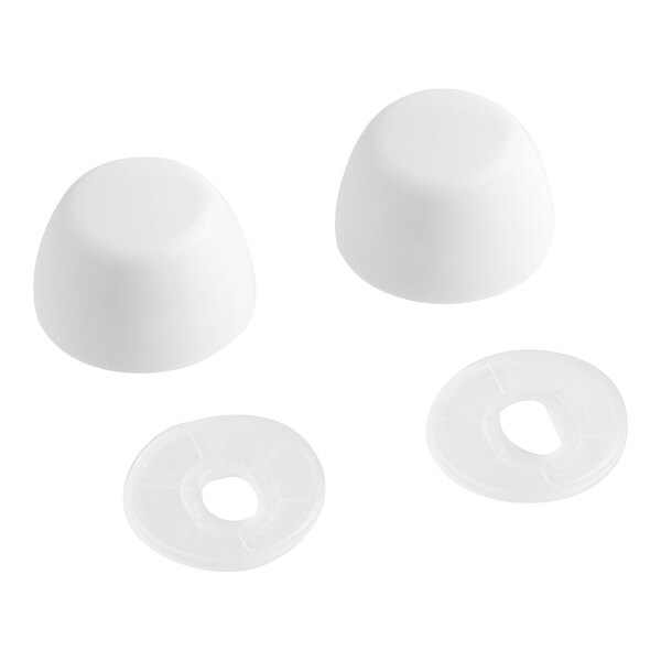 Two white plastic caps with holes on them.