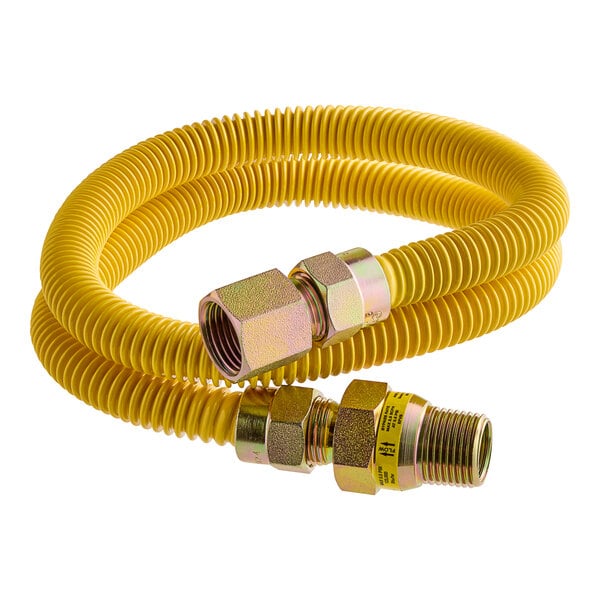 A yellow Eastman gas connector hose with a metal nut.