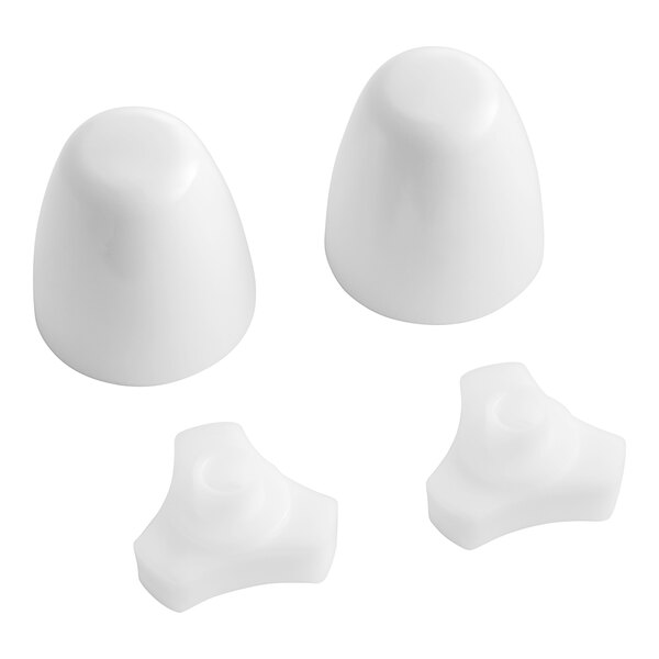Two white plastic caps with a spiral on the bottom and a hole at the top.