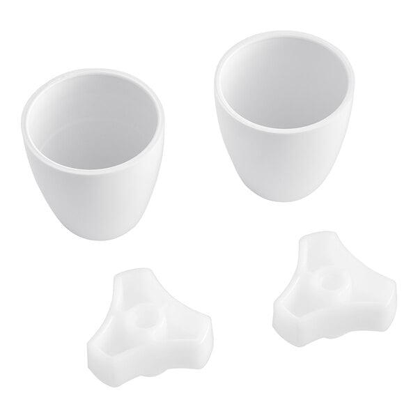 A white plastic American Standard Bolt Cap Kit with two parts and holes.