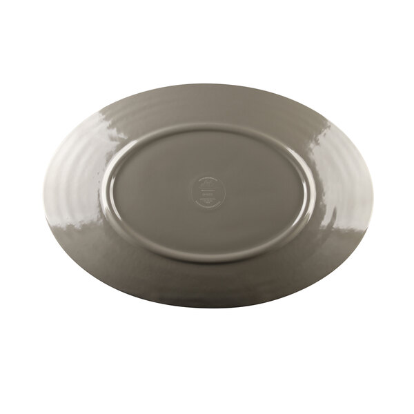An oval melamine platter with a mushroom-colored rim.