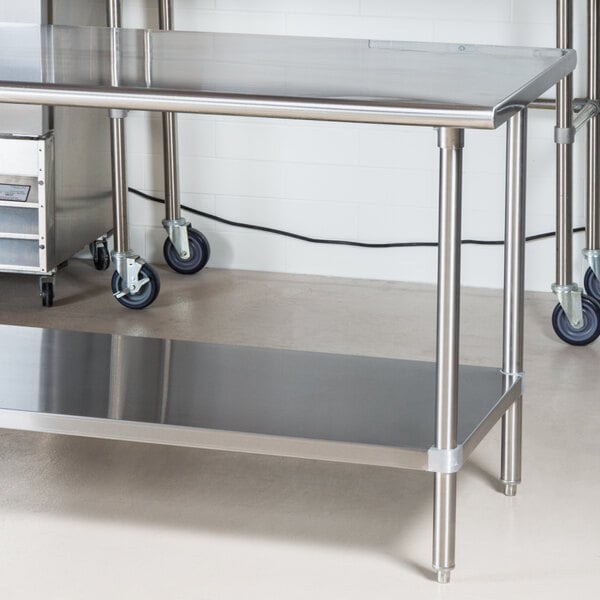 A stainless steel Advance Tabco work table with undershelf.