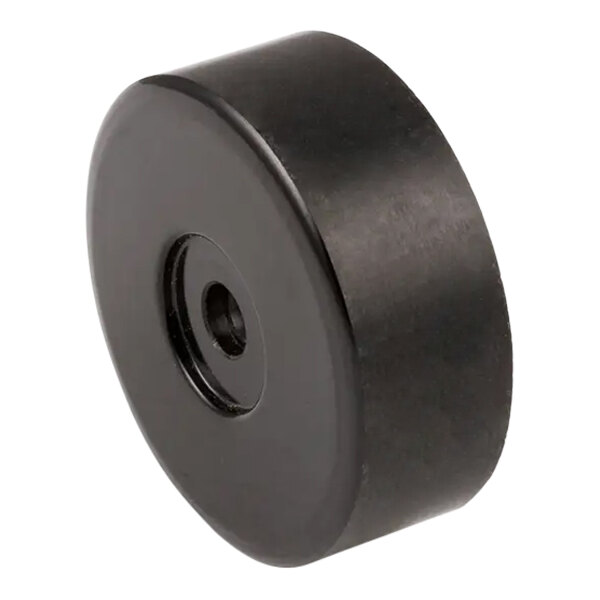 A black plastic Sterling Multimixer drive disc with a black rubber circle.