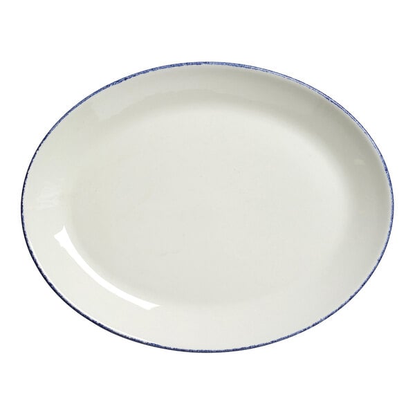 A white oval plate with a blue dappled rim.