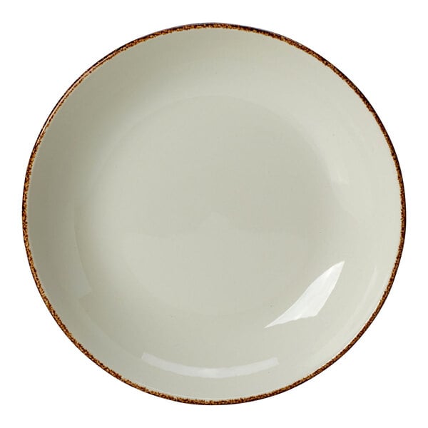 A white coupe bowl with a brown speckled rim.