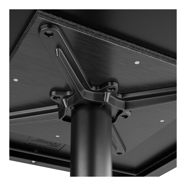 A close up of a black metal Lancaster Table & Seating bar table top with a textured finish.