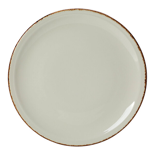 A close up of a Steelite Performance pizza plate with a white surface and brown rim with brown speckles.