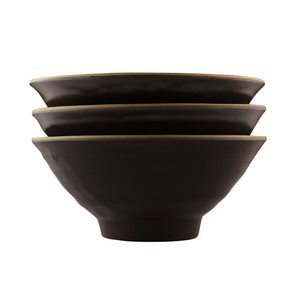 A stack of three Tapenade-colored melamine bowls with gold rims on a white background.