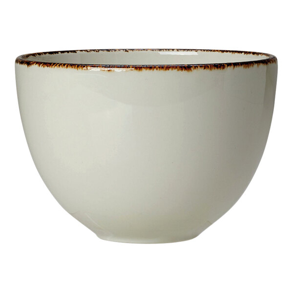 A white Steelite Performance china cup with brown specks.