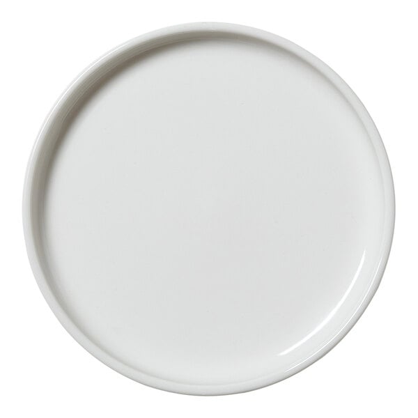 A close-up of a Steelite Performance Taste white plate with a round edge.