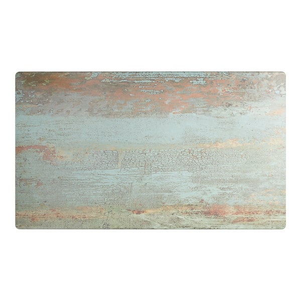 A rectangular table top with a textured canyon painted faux metal finish.