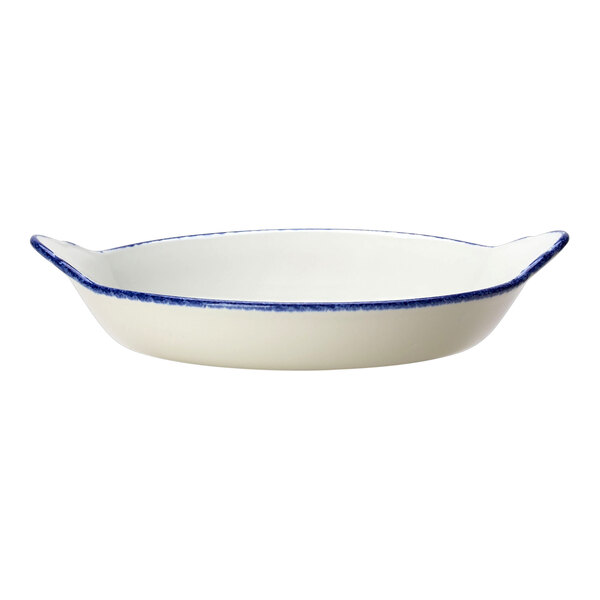 A white round eared dish with a blue dapple rim.