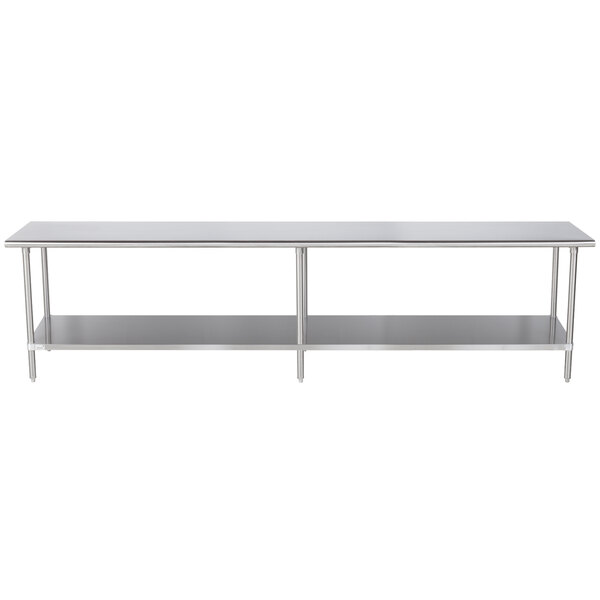 A long silver stainless steel table with shelves underneath.
