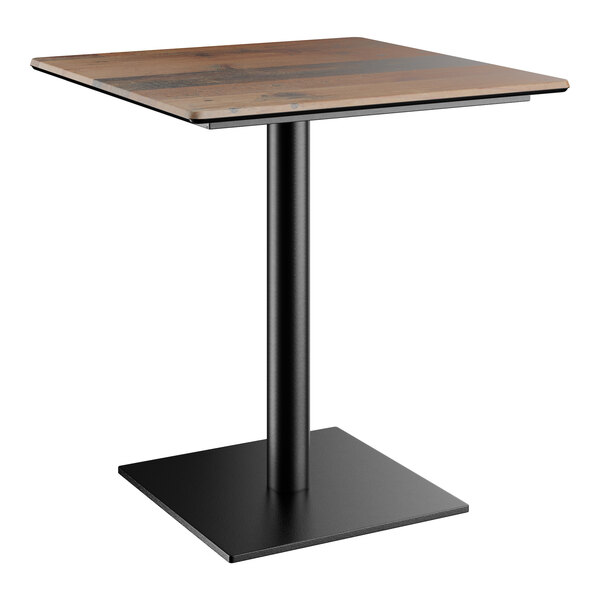 A Lancaster Table & Seating Excalibur square table with a wooden top and black square base.